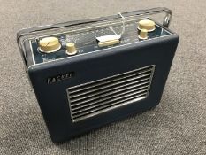 A vintage radio : Hacker VHF Herald, model RP 37A, in a blue case.