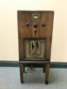 An early 20th century Cossor receiver on stand.