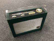 A vintage radio : HMV in green case.