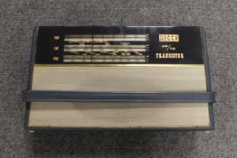 A Decca transistor radio in blue case.