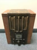 An early 20th century valve radio in a stained beech wood case.