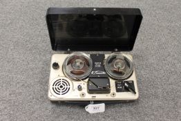 A Dinatone four transistor reel player.