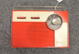 A Murphy transistor in red and cream case.