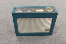 A HMV portable receiver in turquoise case.