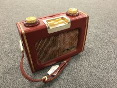A vintage radio : Eveready Skymaster in red case.