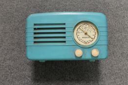 A Countryman Electric Corp. blue plastic radio. CONDITION REPORT: Case damaged.