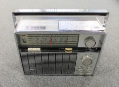 A Sharp Multiband DeLuxe transistor radio.