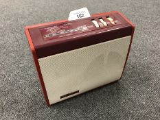 A vintage radio : A Sky Queen in red case.
