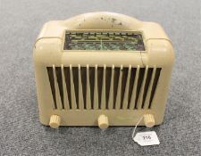 An early 20th century Marconiphone cream cased radio.