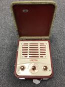 An Eveready Sky Baby portable radio, red.