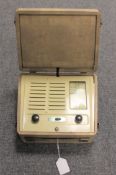 A Vidor portable receiver in cream case.