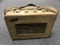 A vintage radio : Hacker Herald in a cream case.