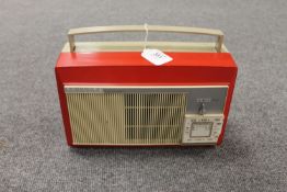 A vintage radio : Philips portable radio in red case.