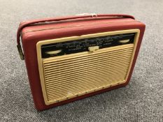 A vintage radio : Dynatron in red case.