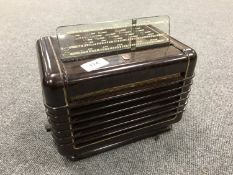 A Philips brown Bakelite cased valve radio, model 49680.