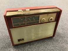 A vintage radio : HMV transistor 7 in red case.