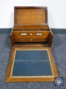 A Victorian oak correspondence box fitted with a calendar