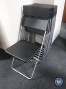 Eight folding Ikea chairs