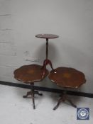 A pair of wine tables and one other