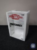 A revolving counter top display cabinet bearing 