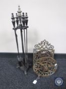 A four-piece companion set on stand,