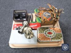 A tray of dominoes, buttons, cuckoo clock, stereo viewer,