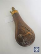 A 19th century copper and brass powder flask