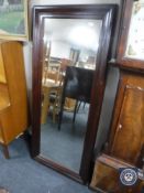 A large framed hall mirror