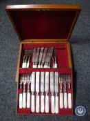A mahogany canteen of fish cutlery