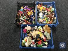 Three baskets containing a large collection of assorted key rings and plastic action figures