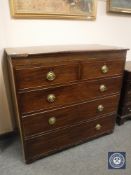 A George III inlaid mahogany chest of five drawers, width 115 cm.