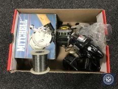 A box of Abu Garcia Cardinal fixed spool reel, multiplier reel,