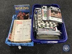 Two crates containing Boxing News magazines and Newcastle United football programmes,