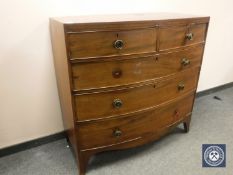 A Regency mahogany bow fronted chest of five drawers, width 106 cm.
