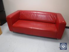 A red leather settee