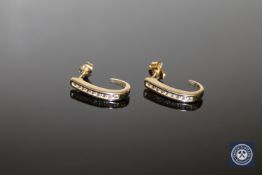 A pair of 9ct gold diamond set earrings,