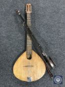 A Phono fiddle with bow and an eight-stringed flat back mandolin