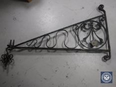 A large wrought iron wall bracket
