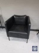 A contemporary black leather reception armchair