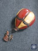A wooden hanging model of a hot air balloon