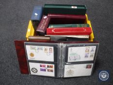 A box of stamp albums and stamps plus first day covers
