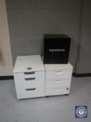 A metal safe with keys and two three-drawer desk chests