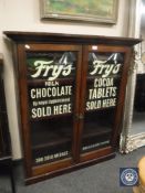 A Victorian and later inlaid mahogany bookcase with Fry's advertising,