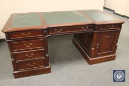 A mahogany twin pedestal partners desk, width 180 cm.