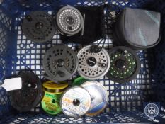 A basket of assorted fly reels and spools