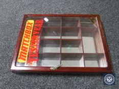 A curio cabinet bearing 