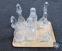 A tray of five lead crystal decanters and a glass swan