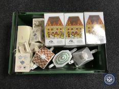 A crate of Ringtons teapots and storage jars