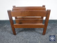 A mid 20th century teak magazine rack