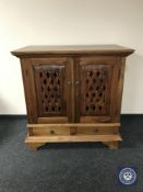 An Eastern mahogany entertainment cabinet